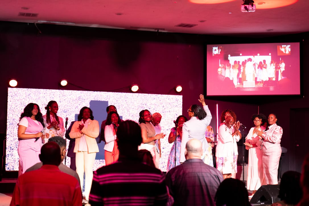 Women gathered on stage at a Vertical Tampa event