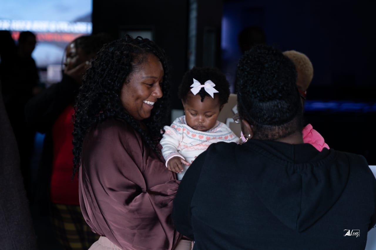 A family sharing a joyful moment at Vertical Tampa