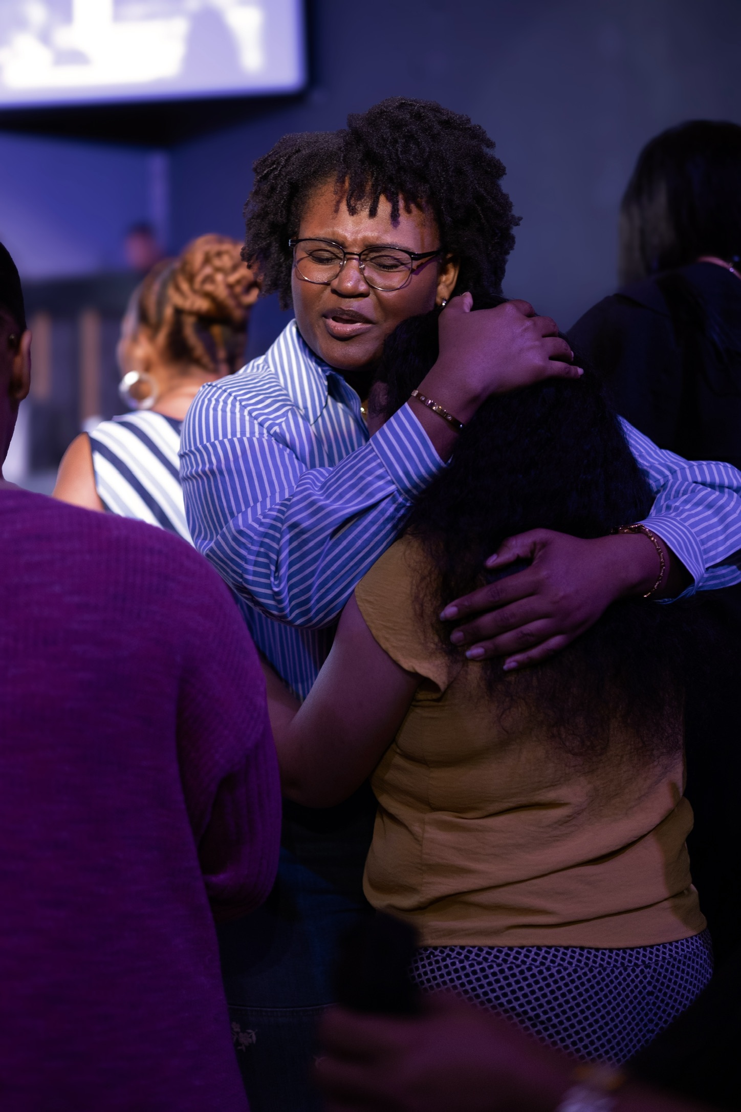 A prayerful embrace at Vertical Tampa
